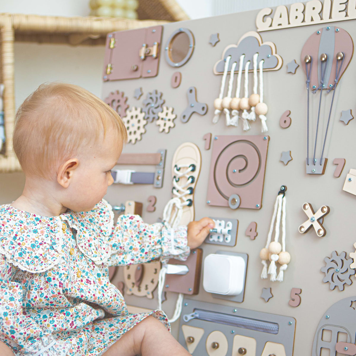The child plays with an educational board